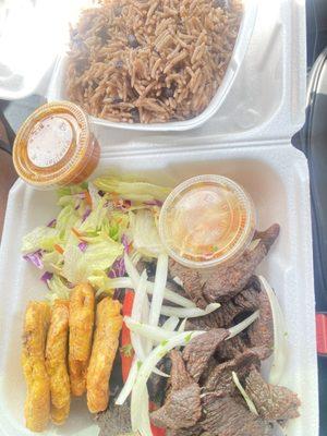 7. Tassot Boeuf (fried beef and rice with black beans) served with a side salad and fresh plantains