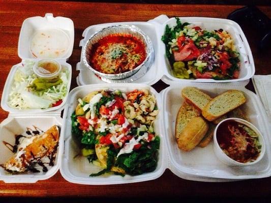 Side salad, eggplant rollatini, italian panini, spinach and artichoke dip, chicken Caesar panini, and cannoli for one.