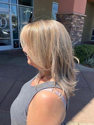 blending in her silver and grey with highlights for a more natural effect