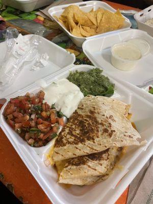 Chicken quesadilla, queso cheese and chips