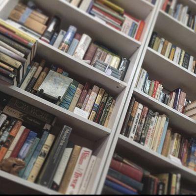 Looking up at the shelves of books in the main room.