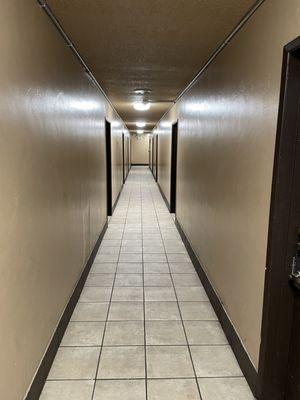 Interior hallway showcasing private indoor room entry.