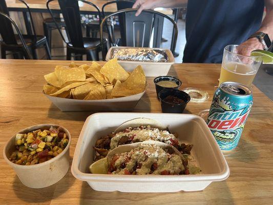 Chicken tacos, poblano corn salad, chips & salsa and the carne asada burrito