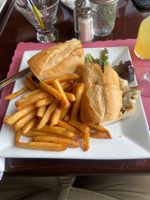 Steak sandwich with mushrooms, I chose Swiss cheese and onions with delicious French fries(perfectly seasoned and crispy)