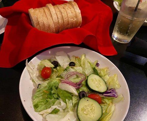 Side salad and lunch and loaf of fresh bread