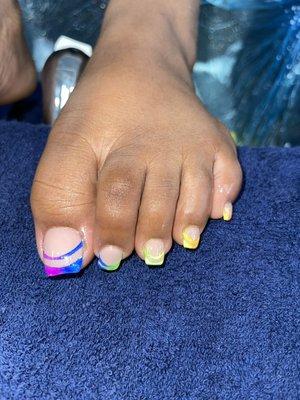 Rainbow design with the pedi  Olivia is the daughter of Heather and she did the design