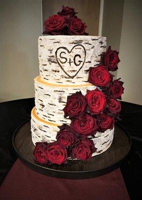 Birch cake with a cascade of roses