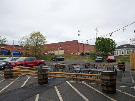 Outdoor beer garden is just a cordoned off area in a parking lot