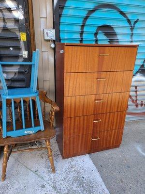 Tall dresser with wood chairs