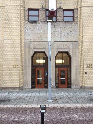 Front door entry to the office building located at 333 N Alabama St.