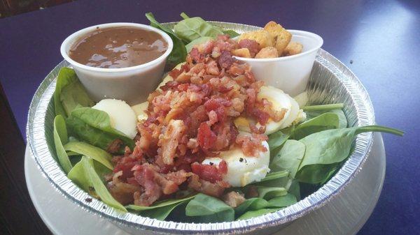 Spinach bacon salad.  Fresh spinach and great bacon.