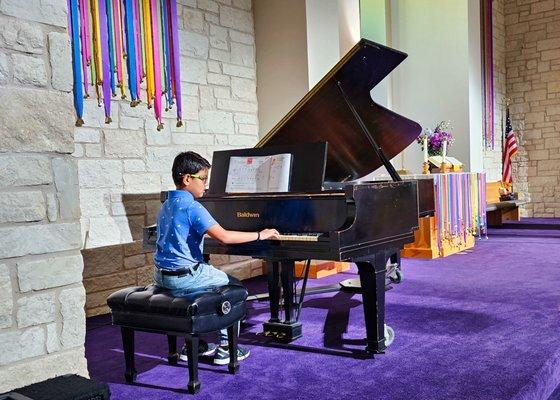 Student performing at recital.