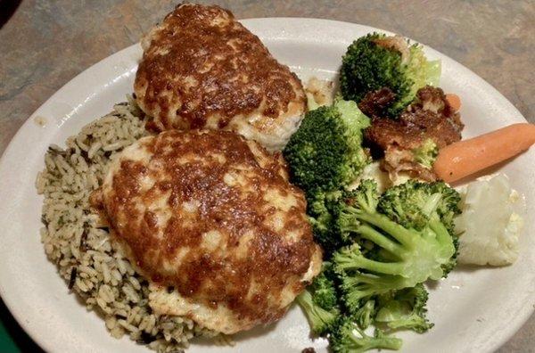 Chicken breasts: grilled with melted Parmesan cheese over wild rice.