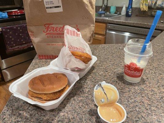 Crispy Chicken sandwich, onion rings and sauce! (Plus shake)