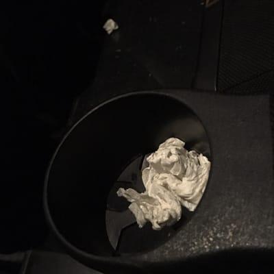 Garbage left in the theater found upon entering the theater. Poor management.