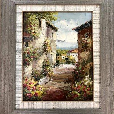 Stacked frames on a Mediterranean themed painting