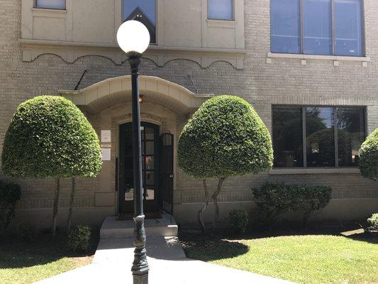 Walk up into the courtyard and the first building on your right is us! Welcome!