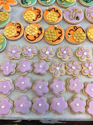 Beautiful baby shower cookies with hand painted bees as well as fondant honey combs