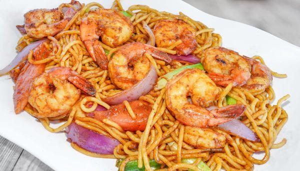 Jumbo shrimps, sautéed onions and tomatoes, spaghetti, shrimp tallarín saltado