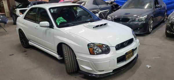 Subaru STI just almost installed all outside Parts moldings Etc and refurbished restore everything