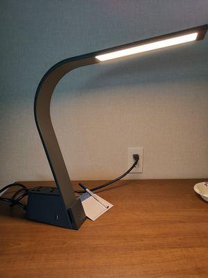 Desk lamp with internation plugs and a USB port. There USB ports at each night stand too.