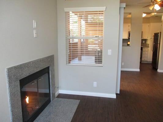 Looking from the living room toward the dining area and kitchen of the upgraded, downstairs 2 bed/2 bath apartment.