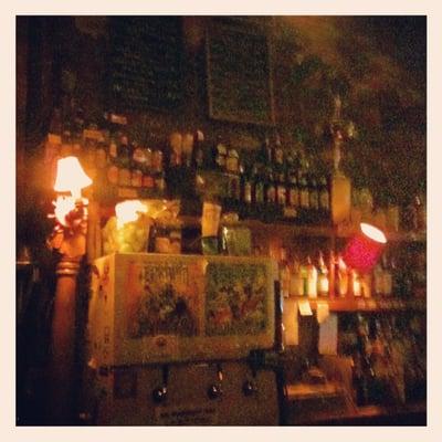 The fridge changes the beers on draft. Fully stocked bar. Low lighting as you can tell--gives this place a cozy vibe.