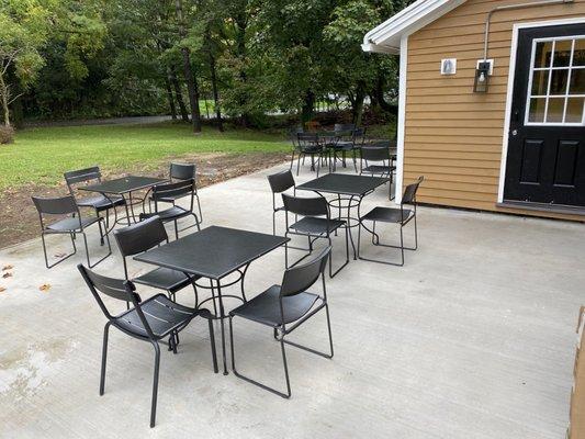 Outside patio dining with fire pit.