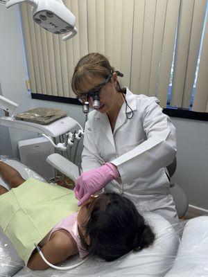 Toddler getting teeth cleaning