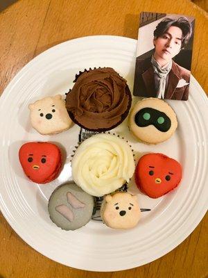 BTS themed macaron assortment and a vanilla and chocolate cupcake and TAE of course