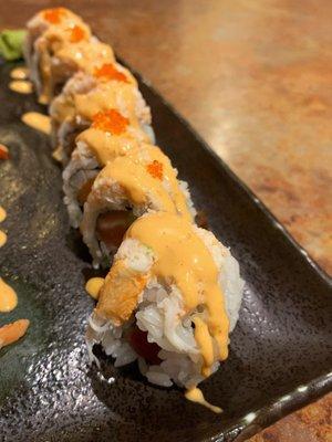 Phoenix Roll - fresh salmon, tuna, cucumber roll topped with real crab meat, spicy mayo and tobiko