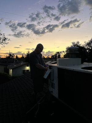 Enjoying the sunset with a rooftop view.