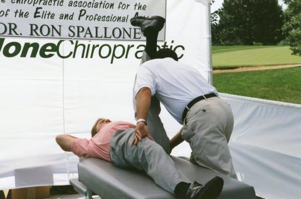 Chiropractor Dr. Ron Spallone warms up Hall of Fame Bronco, John Elway for a his charity golf tournament.