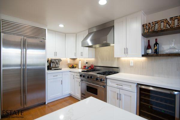 Custom Cabinetry, Quartz Countertops, State-of-the-Art Appliances, Lighting, and Dining Area.