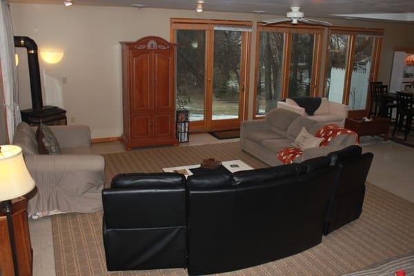 Comfortable living room area with large screen TV, DVD's and family board games.