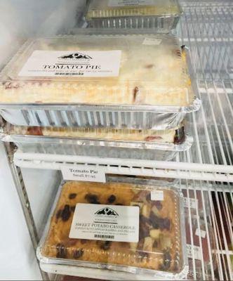 You can purchase take home frozen options - their Tomato pie is a must