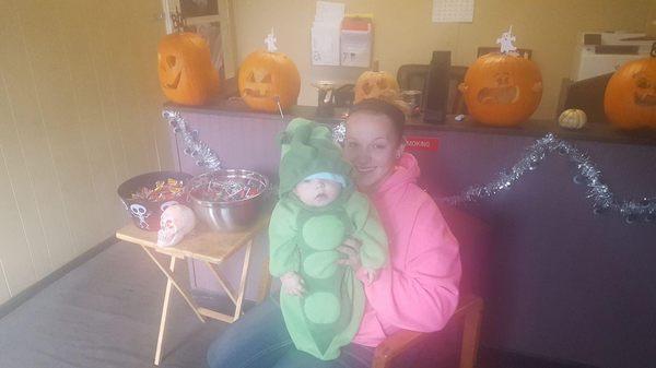 Handing out candy during Paw Paw Business Safe Trick-Or-Treating