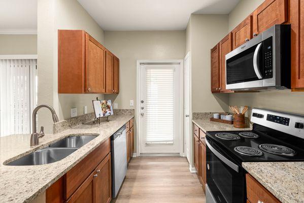 Kitchen with stainless steel appliances at the Villas at Medical Center