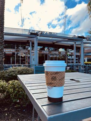 Flat White outside Cafe de Paris