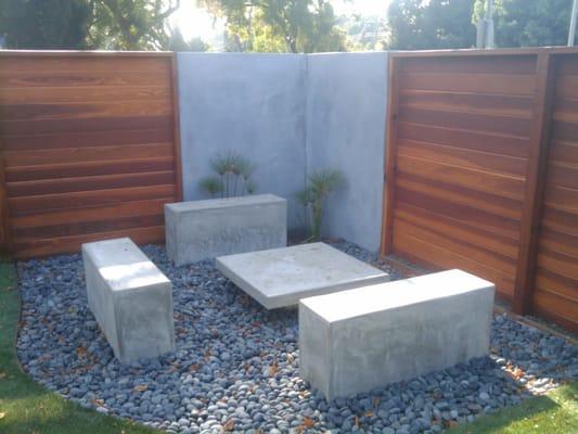 Concrete and wood fence and sitting area