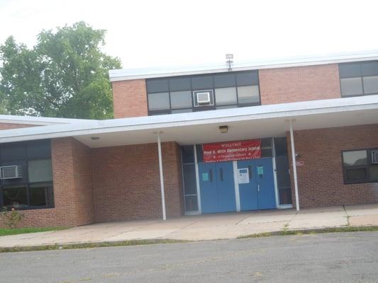 The monument is in a field behind this elementary school