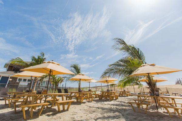 Beach seating is available at our Palm Grill restaurant, or you can choose to sit at our poolside tables on our large patio.