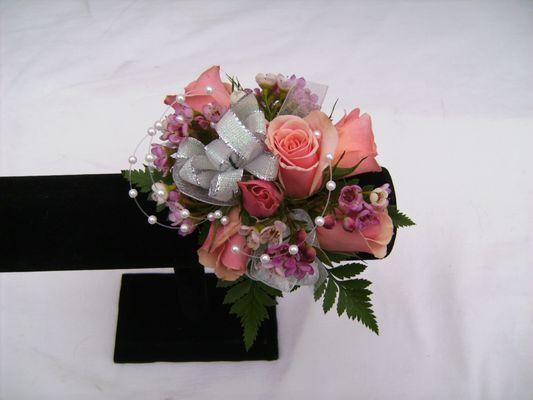 Corsage, boutonnière, nosegay, handheld bouquets and wearable flowers for special days, great gifts.  Order in advance