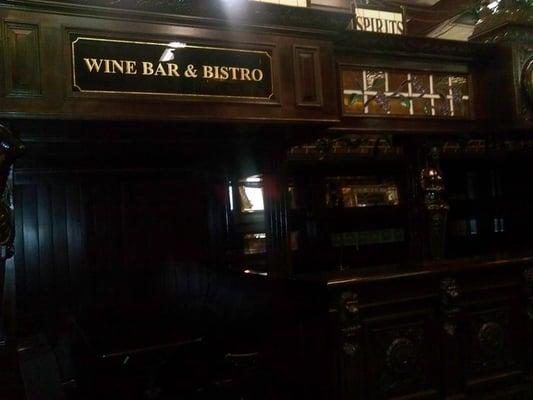 This was an entire bar, including a wooden booth, back shelving and doorway for the bartender.