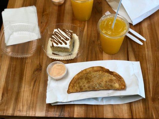 Beef empanadas, shrimp empanadas (freshly made), tres leches cake, parcha (passion fruit) juice.