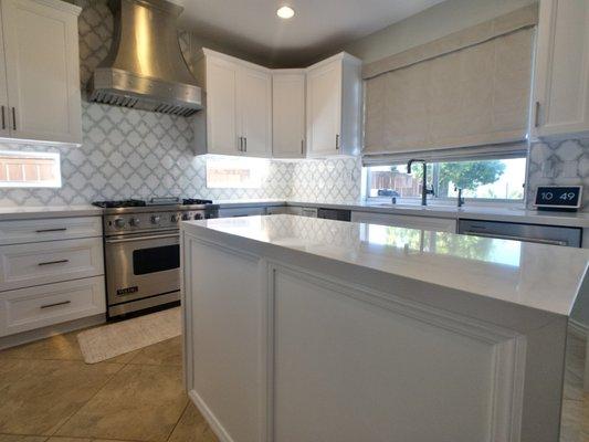 Make a statement with a centered kitchen island with a "waterfall" countertop