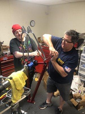 Tristan and Bill working on my frame.