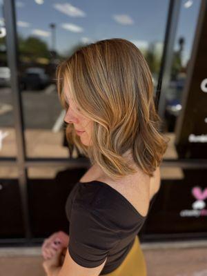 Golden highlights on medium haircut