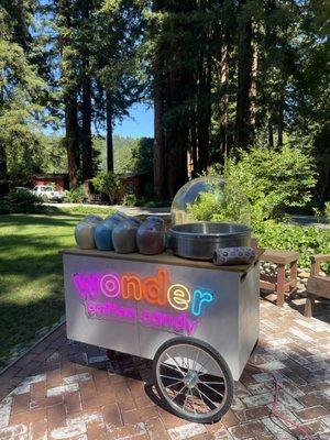 Wonder logo cotton candy cart against redwood forest in the Santa Cruz mountains