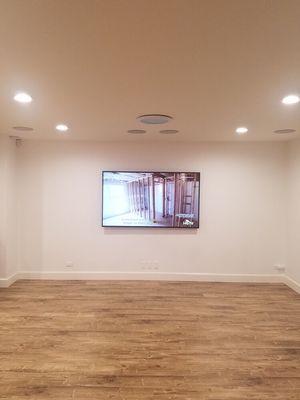 Installed LED TV on wall with hidden audio/video cables; Inst'ld surround sound system with in-ceiling speakers; Inst'ld LED recess lights.